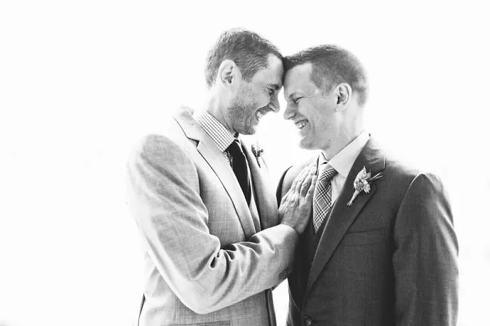 Two men looking each other into the eyes 