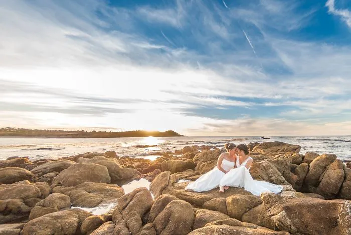 Two women sitting on a rock 