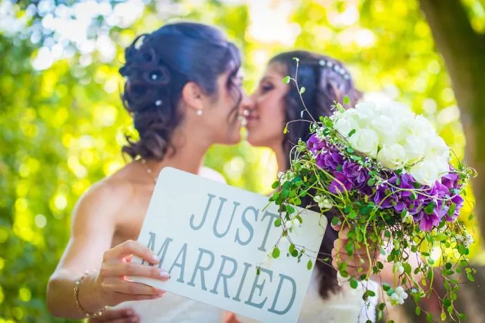 Two women kissing 