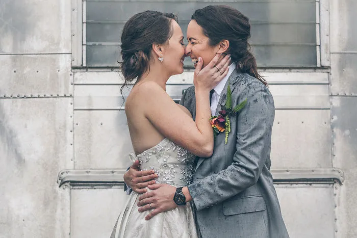 Two happy woman hugging and kissing 