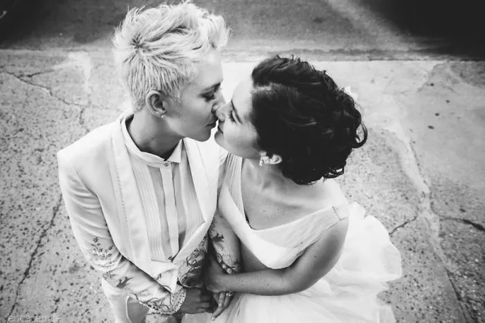Two women kissing 