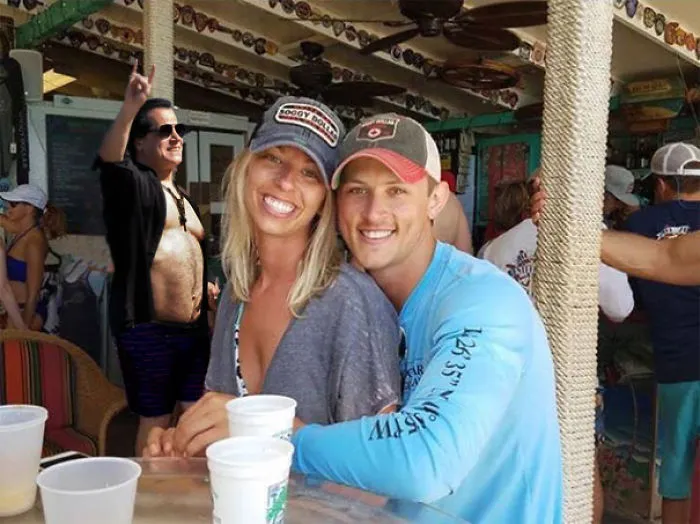 Couple Asks Internet To Photoshop Out Shirtless Guy From Engagement Photo, Regrets It Immediately