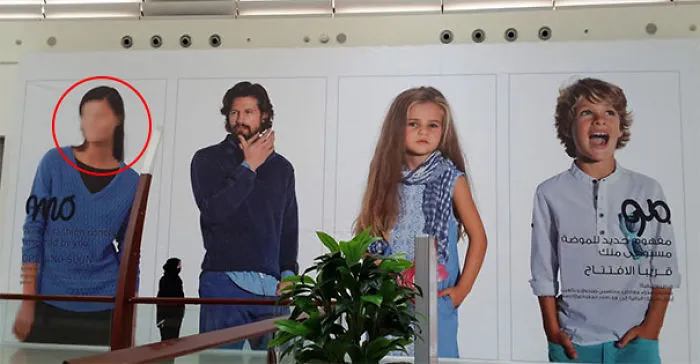 Advertisement posters showing fashion trends differences in the West vs. Middle-East.