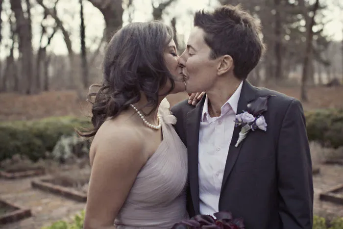 Two women kissing 