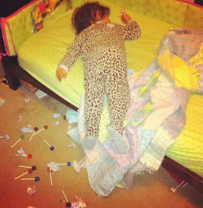 My 2 Year Old Got Caught Opening All Her Lollipops Instead Of Sleeping. The Fake Sleeping With Evidence In Her Hand Was Priceless