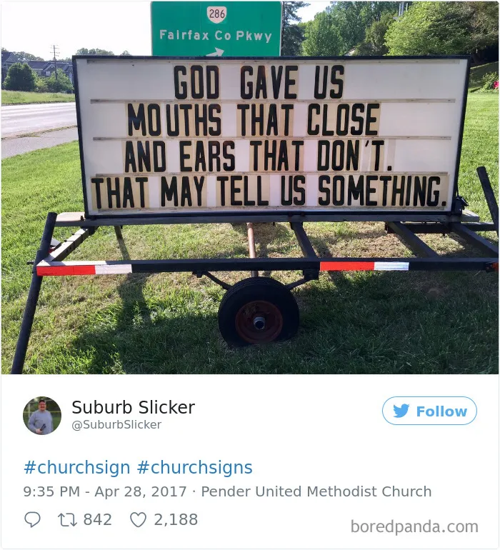 Funny church sign with a witty message about mouths and ears on a grassy roadside.