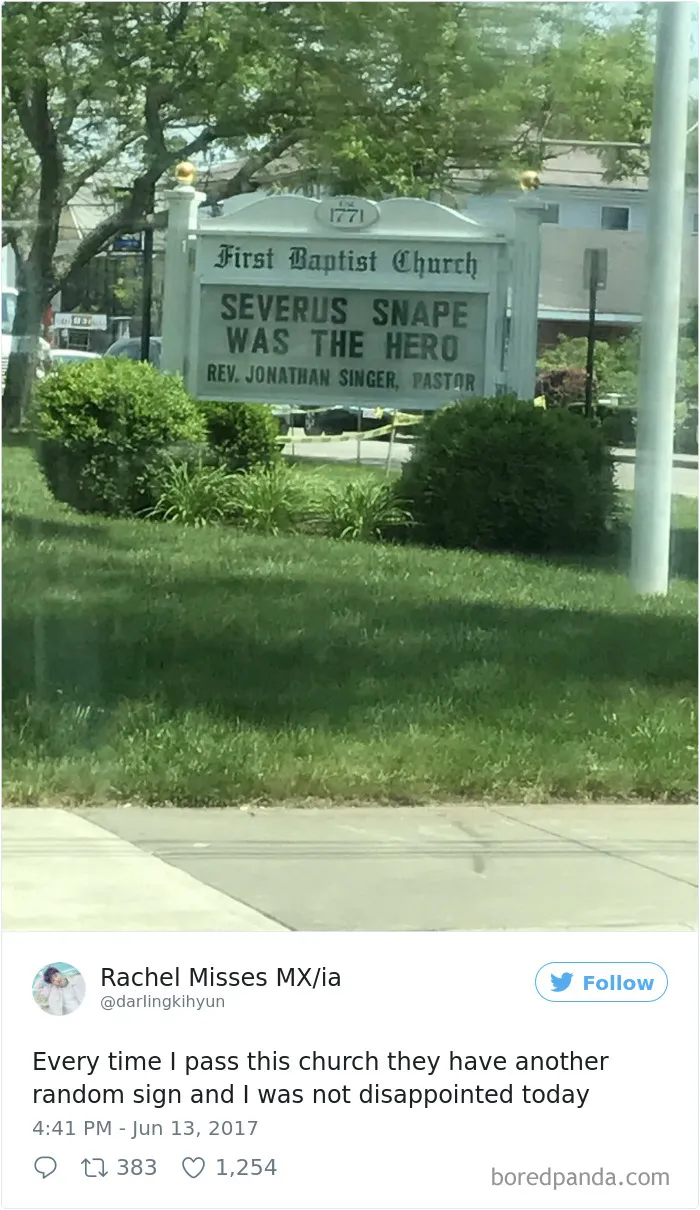 Funny church sign reading "Severus Snape was the hero" in front of First Baptist Church with greenery around.