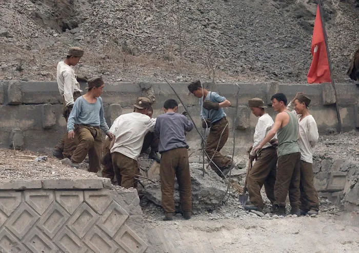 Workers On The Highway Are Repairing The Road
