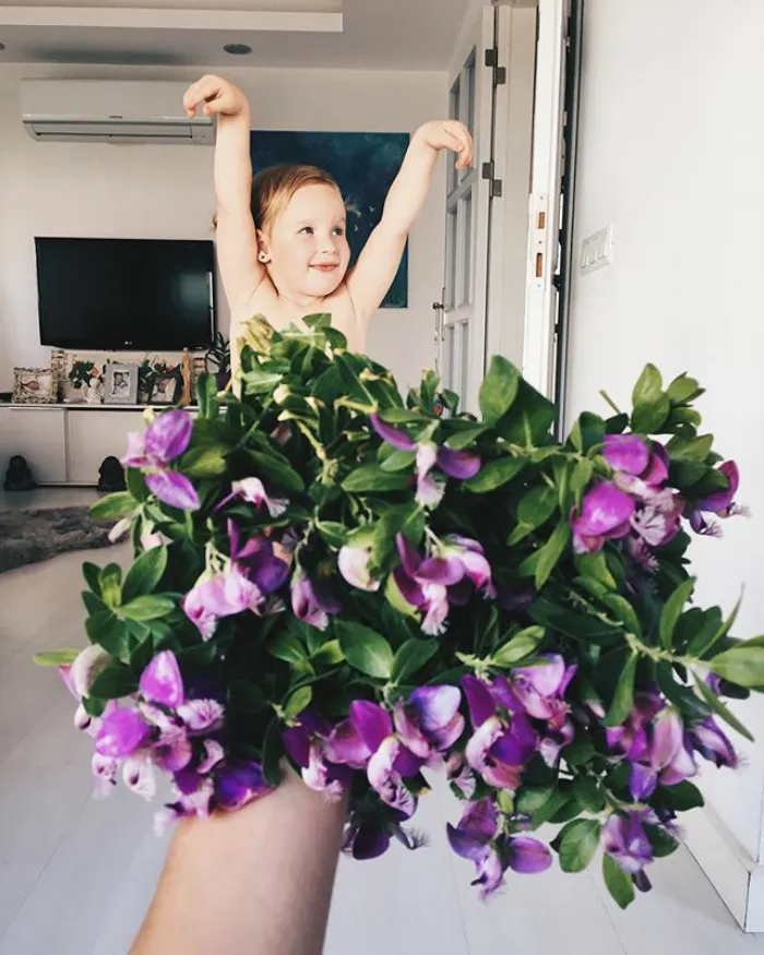 Mom "Dresses" Her Daughter In Food And Flowers Using Forced Perspective, Becomes Internet Star