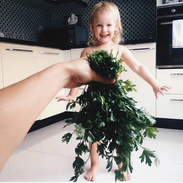 Mom "Dresses" Her Daughter In Food And Flowers Using Forced Perspective, Becomes Internet Star