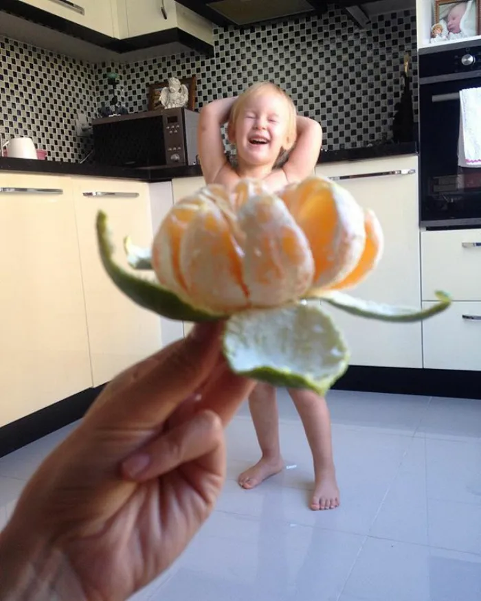 Mom "Dresses" Her Daughter In Food And Flowers Using Forced Perspective, Becomes Internet Star
