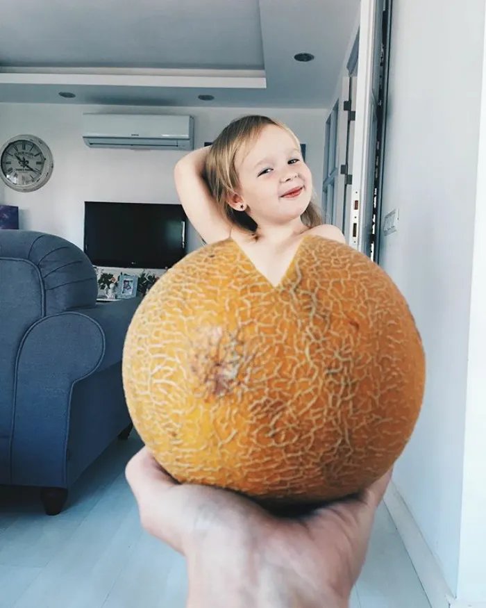 Mom "Dresses" Her Daughter In Food And Flowers Using Forced Perspective, Becomes Internet Star