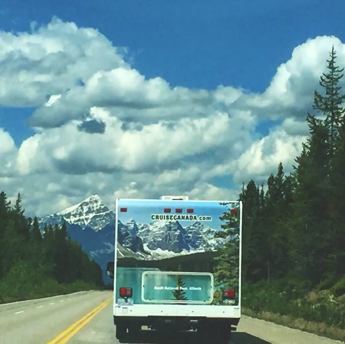 The Mountains And Trees Lined Up Perfectly On This Camper On The Highway