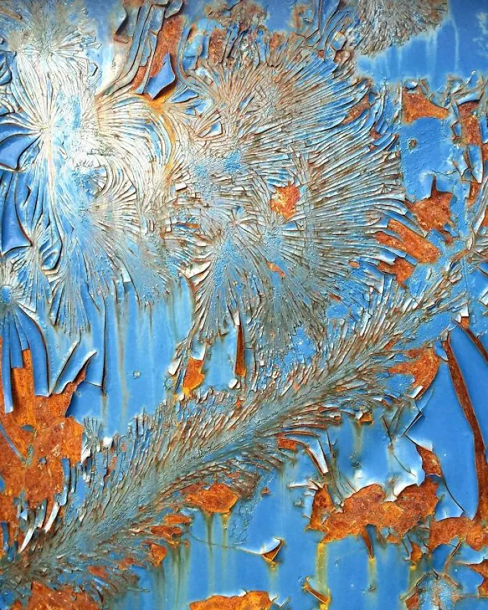 Old Paint On A Rusted Container