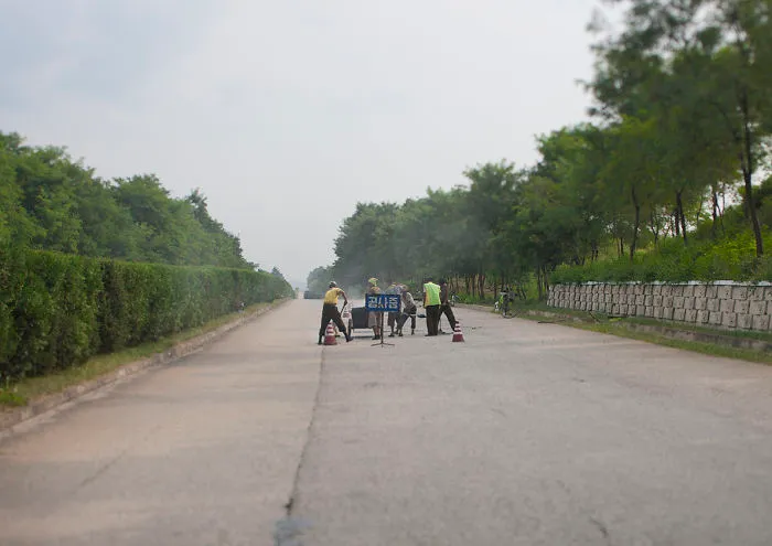 Lots Of Holes Can Be Found On The Highways, So Lot Of Workers Are Trying To Fix The Road