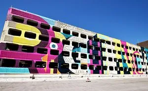 Street Artist Transforms 60s Carpark With Giant, Candy-Striped Supergraphic Artwork