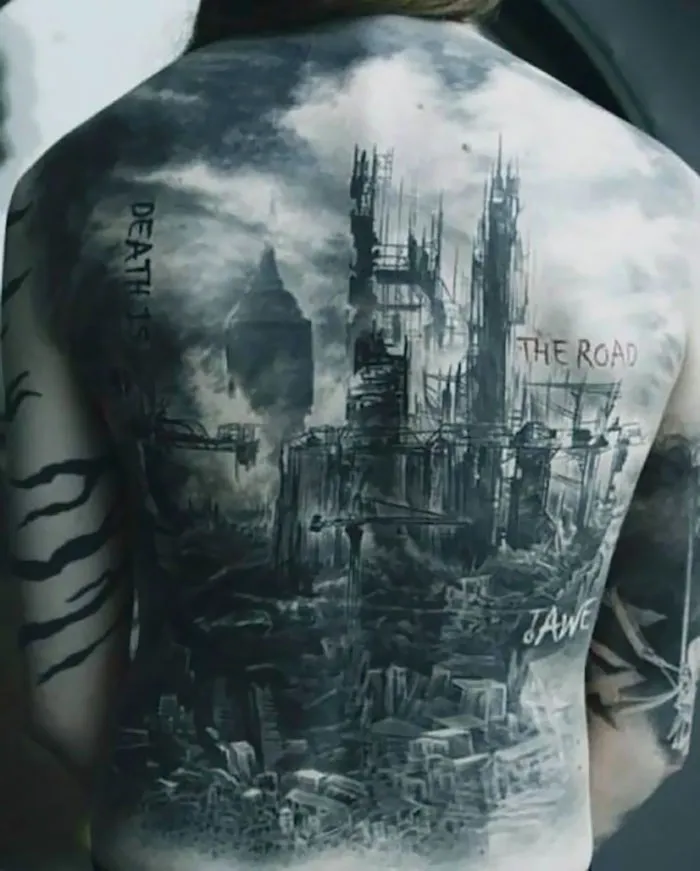 Back tattoo of dystopian architecture with text "Death is the Road to Awe."