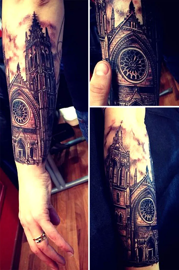 Architecture tattoo showcasing a detailed Gothic cathedral design on a person's forearm.