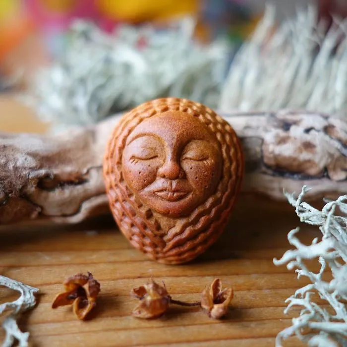 Most People Throw Away Avocado Pits, But This Artist Carves Them Into Magical Forest Creatures