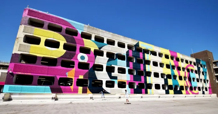 Street Artist Transforms 60s Carpark With Giant, Candy-Striped Supergraphic Artwork