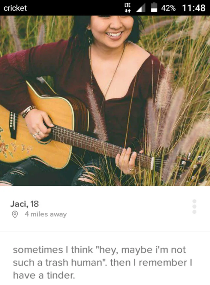 Person outdoors playing guitar with a funny Tinder profile description.