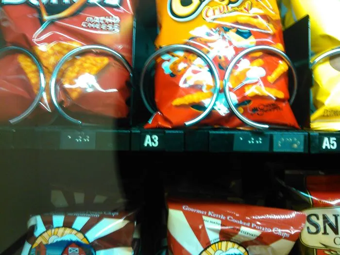 Braille Behind Vending Machine Glass