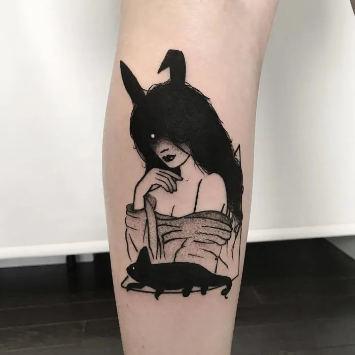 Tattoo of faceless girl with long hair and a cat, emphasizing a mysterious, slightly erotic design style.