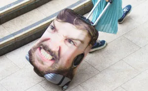 People Are Laughing At This Luggage Cover That Uses Giant Pic Of Your Face But It's Actually Genius