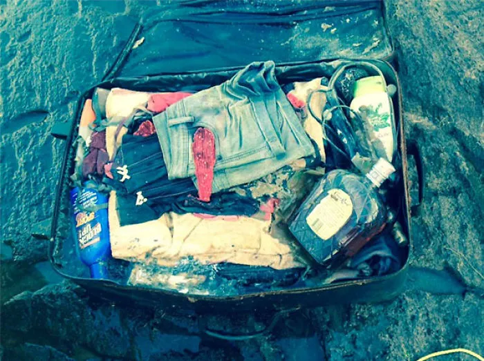 6 Years Ago My Ex Lost Her Luggage At The Cottage. It Was Found Floating Down The River This Weekend By My Mother. Bonus Whiskey Inside!