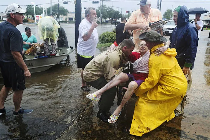 Neighbors Used Their Personal Boats To Rescue Jane Rhodes In Friendswood, Texas
