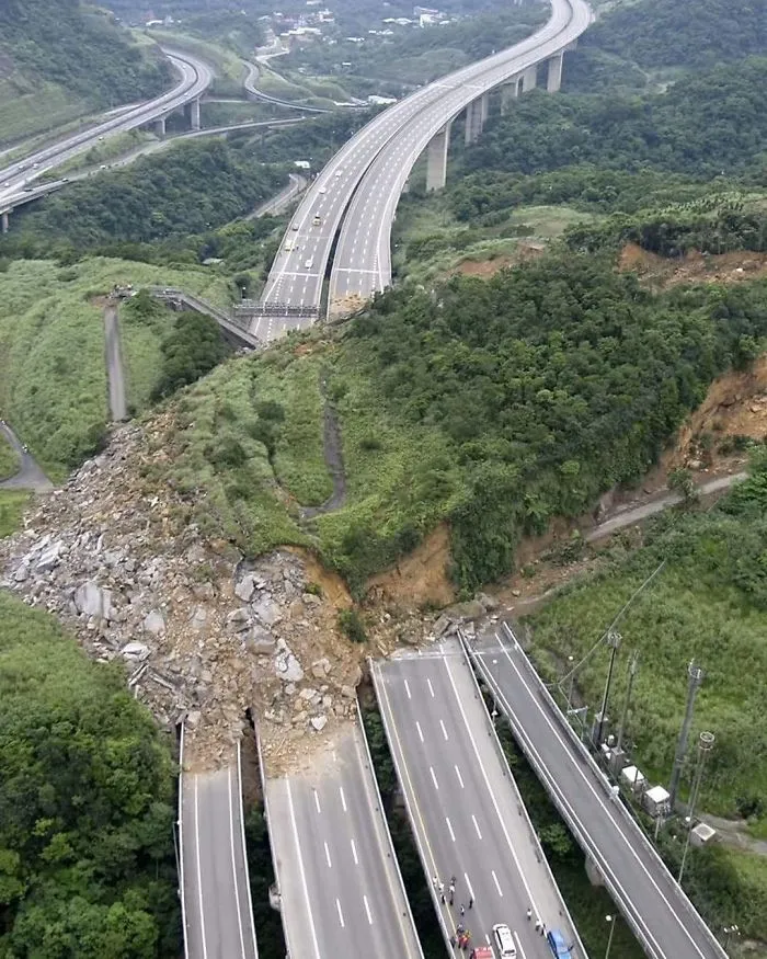 Landslide causing highway collapse in nature, creating a dramatic and scary scene.