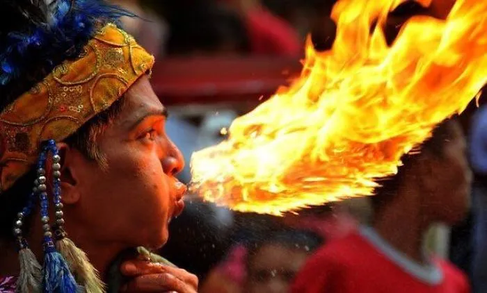 Fire Breather Looks Like He's Kissing A Fire Dragon