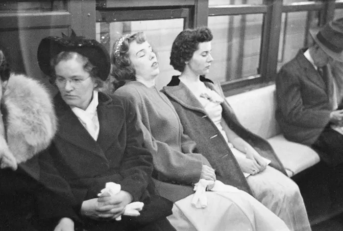 People on a 1940s New York subway captured in a candid photo by young Stanley Kubrick.