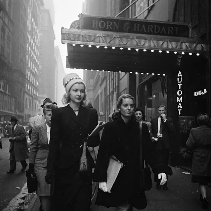 1940s New York street scene by young Stanley Kubrick, showcasing people walking past Horn & Hardart Automat.