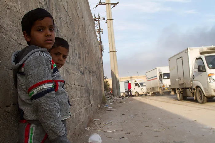Boys Waiting For A Humanitarian Aid