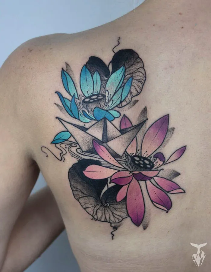 Nature and Art Nouveau inspired tattoo featuring colorful flowers on back.