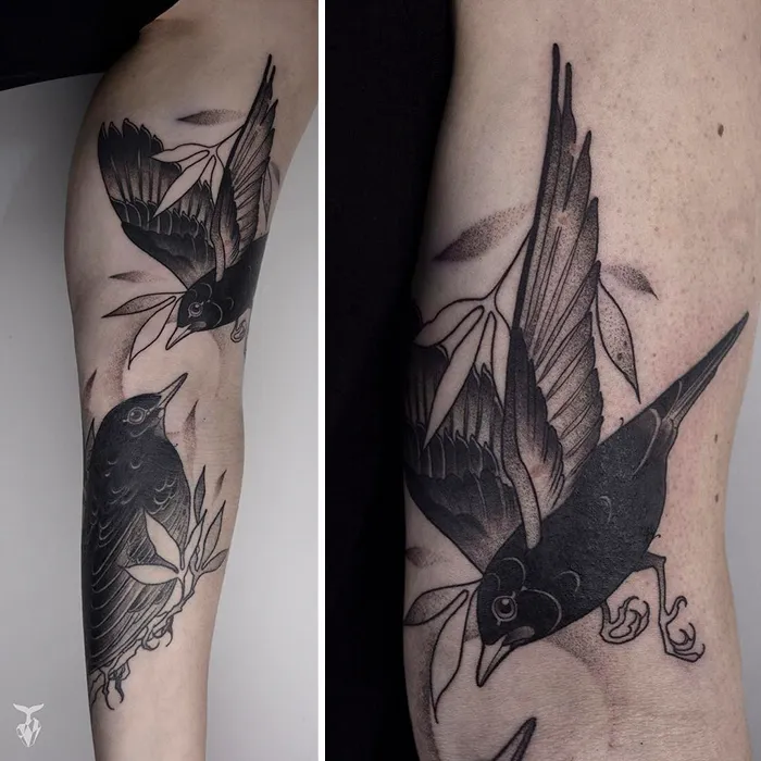 Nature and Art Nouveau inspired bird tattoo with detailed leaves and shading.