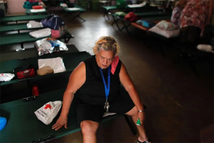 Sylvia Lamzo, 69, Sits On A Folding Bed At An Emergency Center As Hurricane Irma Approaches Puerto Rico In Fajardo