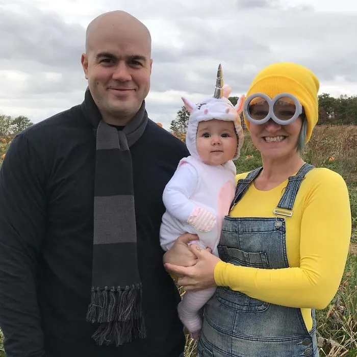 Parents and baby dressed in Despicable Me theme for creative family Halloween costumes.