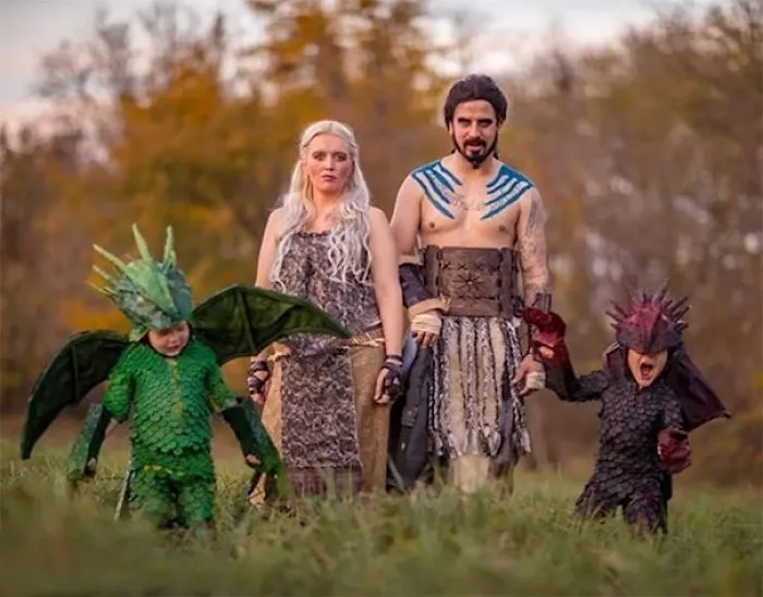 A family wearing Game of Thrones themed Halloween costumes featuring dragons and Dothraki.