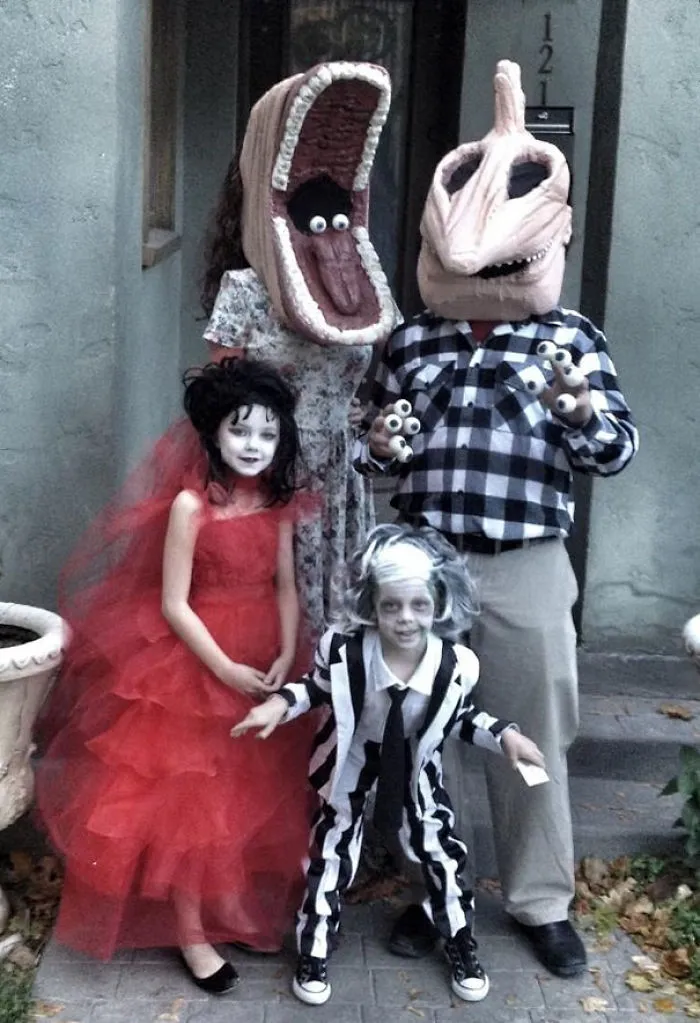 A family dressed in Beetlejuice Halloween costumes including Barbara, Adam, Lydia, and Beetlejuice.