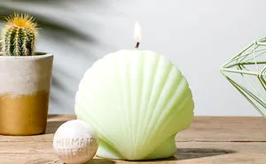 This Dreamy Mermaid Shell Candle Contains Hidden Treasure