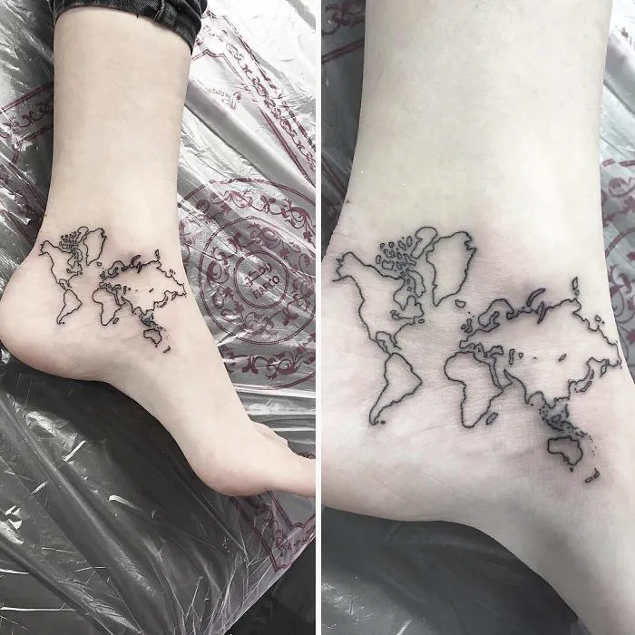 World map travel tattoo on ankle, inspiring wanderlust and adventure.
