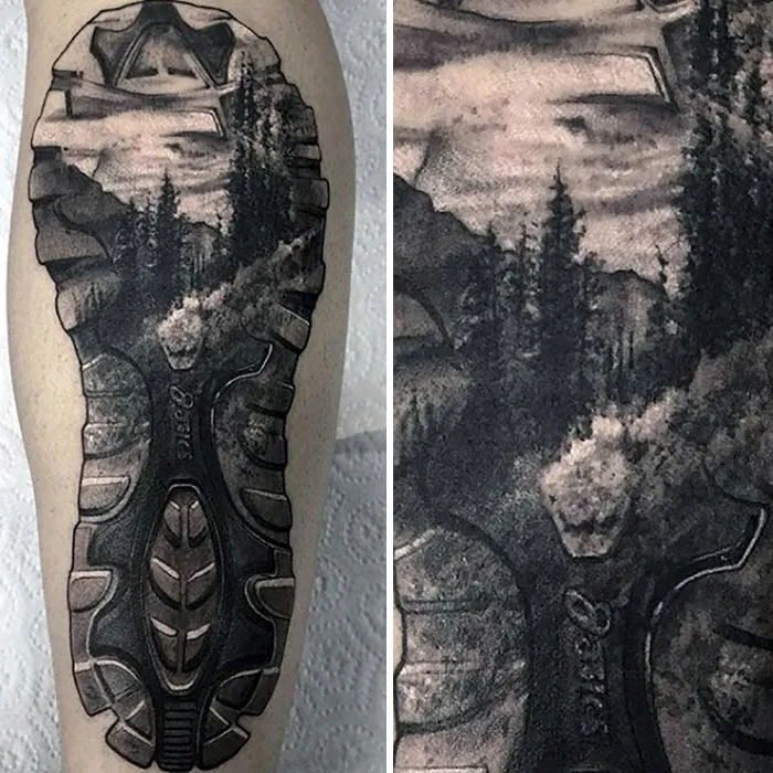 Travel tattoo featuring a scenic landscape in a footprint design on forearm.
