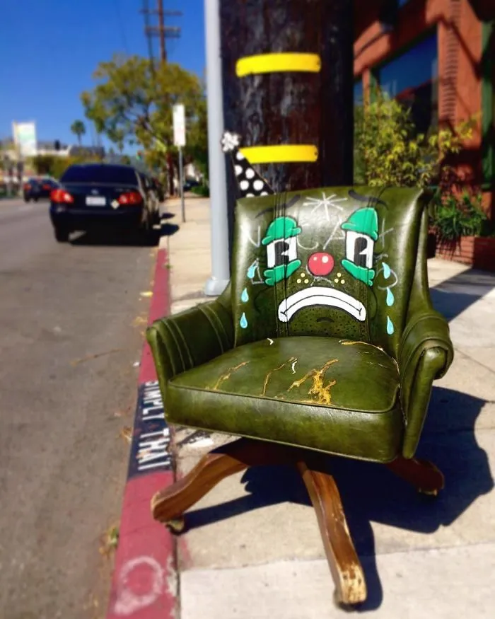 Artist Shows The Sorrow Of Thrown Away Objects He Finds In The Streets By Drawing Sad Clown Faces On Them