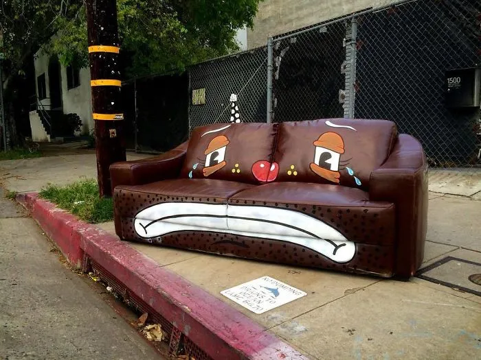 Artist Shows The Sorrow Of Thrown Away Objects He Finds In The Streets By Drawing Sad Clown Faces On Them
