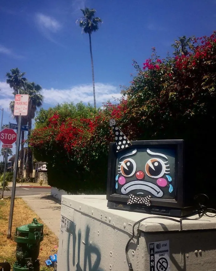 Artist Shows The Sorrow Of Thrown Away Objects He Finds In The Streets By Drawing Sad Clown Faces On Them