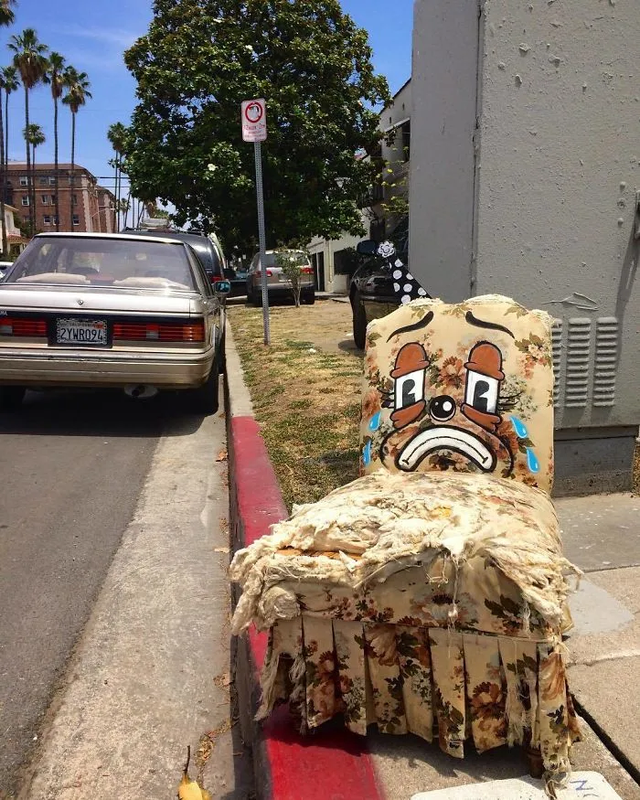 Artist Shows The Sorrow Of Thrown Away Objects He Finds In The Streets By Drawing Sad Clown Faces On Them