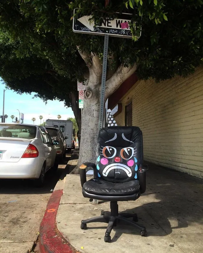 Artist Shows The Sorrow Of Thrown Away Objects He Finds In The Streets By Drawing Sad Clown Faces On Them
