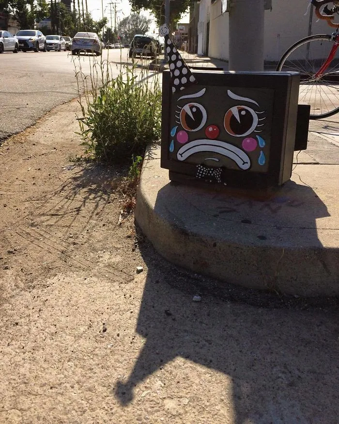 Artist Shows The Sorrow Of Thrown Away Objects He Finds In The Streets By Drawing Sad Clown Faces On Them